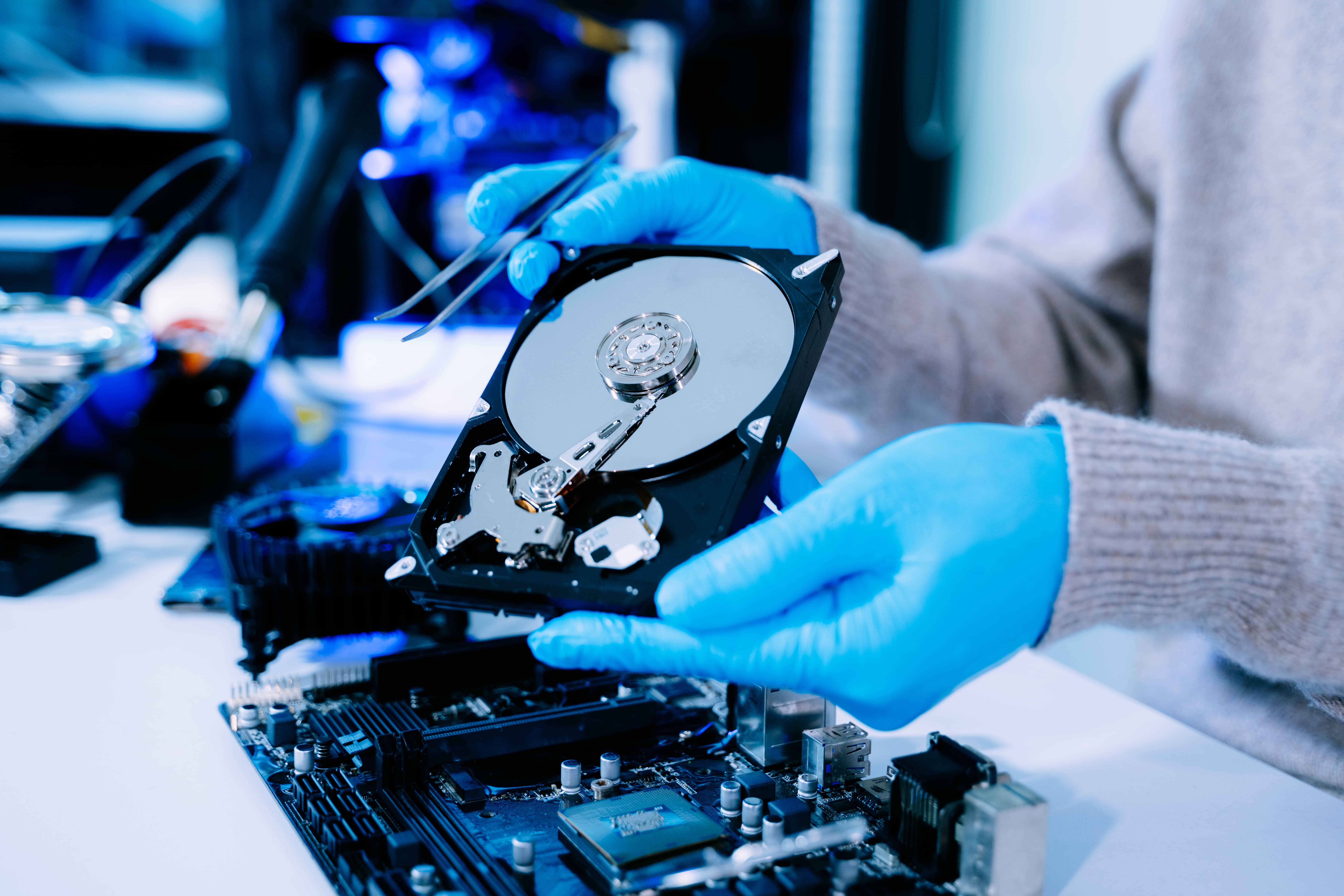 closeup of technician with gloves holding blue har 2026 03 25 10 03 36 utc 1