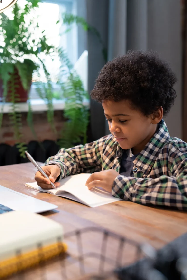 cute little african schoolboy with pen making note 2023 11 27 04 50 45 utc 768x1152