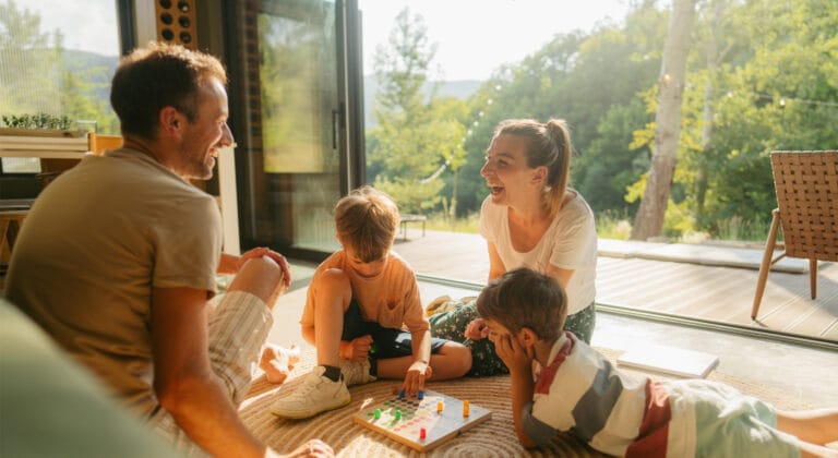services family playing on the floor 768x420